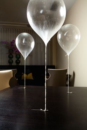 Alinea is one of the most theatrical and forward-thinking restaurants in the United States. One of its most creative dishes is the Green Apple Balloon, an edible inflatable made of apple taffy and helium. 