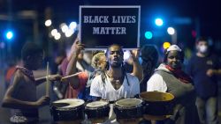 Demonstrators protest in Ferguson, Missouri on August 10, marking the one-year anniversary of the shooting of Michael Brown.