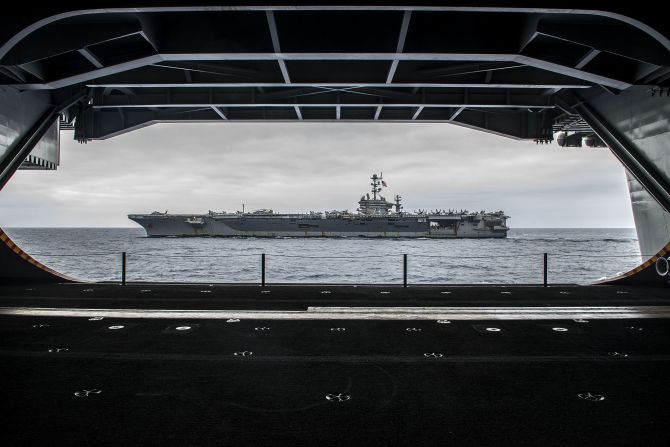 The Nimitz-class aircraft carrier USS George Washington (CVN 73) is seen from inside its sister ship, the USS Ronald Reagan (CVN 76), on August 7 off the coast of California as the two ships prepare for<a href="index.php?page=&url=http%3A%2F%2Fwww.cnn.com%2F2015%2F03%2F04%2Fus%2Fus-navy-three-presidents%2F"> a "hull swap."</a>  Over 10 days in San Diego, much of the crew of each ship will transfer to the other. When completed, the Reagan will head to forward deployment in Japan, where the Washington had been. The Washington will head to Newport News, Virginia, for an overhaul. 