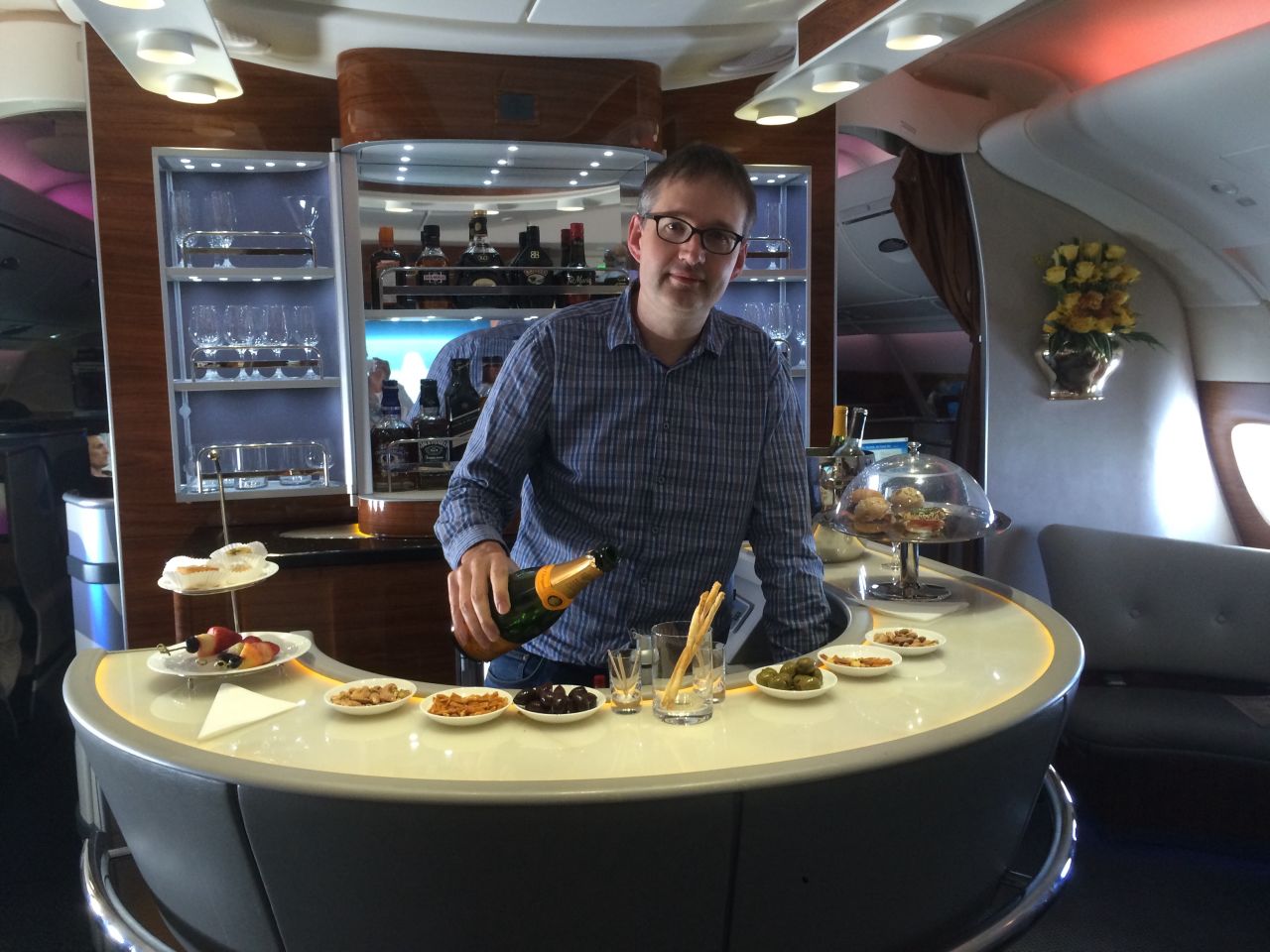 Rob Burgess edits <a href="http://www.headforpoints.com/" target="_blank" target="_blank">Head for Points</a>, which helps fliers "maximize their miles." Here he takes a break at the business class bar on an Emirates A380 flight.