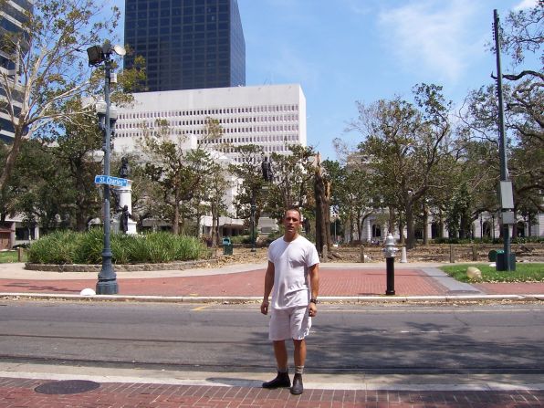 No one was allowed in New Orleans for about a month after the storm, but special passes were given to businesses to transfer their equipment to temporary sites. This photo was taken on September 9, 2005, in front of Lafayette Square Park. The tree behind Chaillot-Louganis was splintered in the storm.