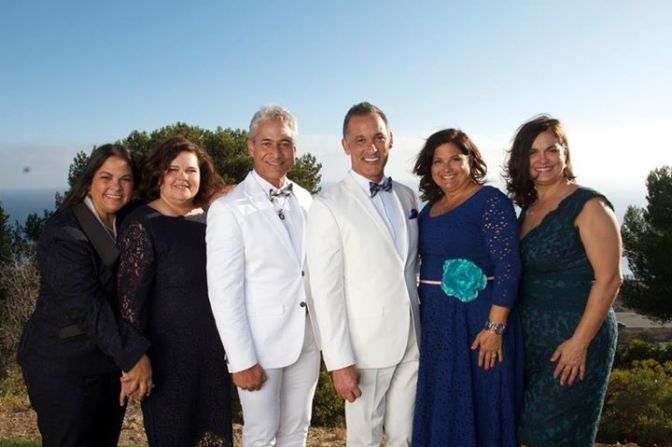 Both in their 50s, the men say they knew they had found "the one" very early on. They were married in October 2013. On the wedding day, the Chaillot sisters stand with Louganis and Johnny. From left are Suzanne, Mimi, Greg, Johnny, Jane and Jackie.