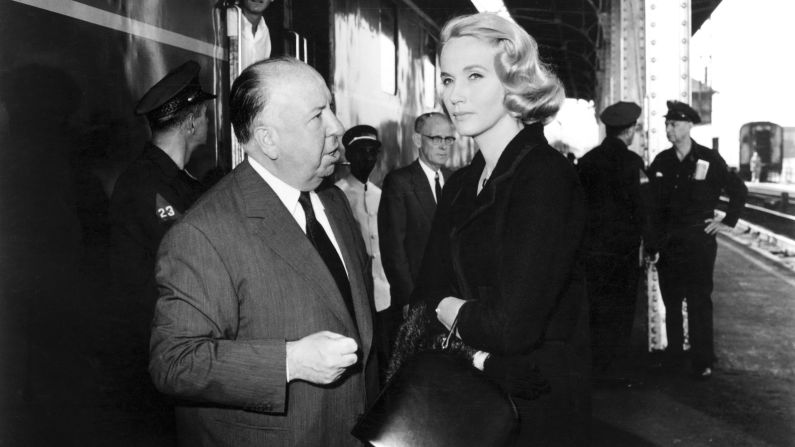 Hitchcock speaks with Eva Marie Saint during filming of 1959's "North by Northwest." The movie was best known for a scene in which a crop-duster plane menaces Cary Grant in a Midwestern field.