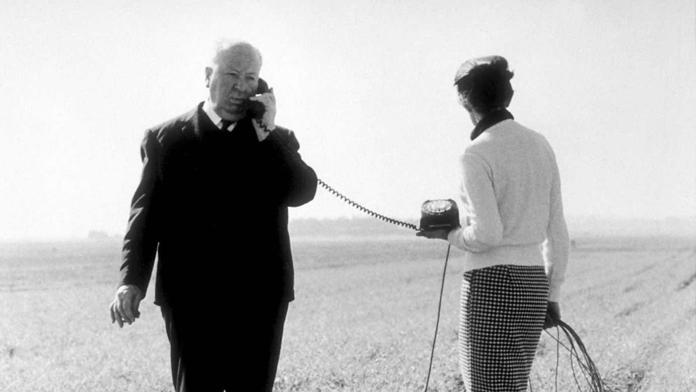 Hitchcock takes a call during filming of the 1966 spy thriller "Torn Curtain," his 50th film. It received mixed reviews but was a minor box office hit. His health began to fail, and the maestro would make only three more movies before his death in 1980.