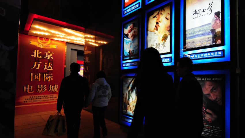 Moviegoers make their way to a multiplex cinema in Beijing on February 14, 2009, where Taiwanese film "Cape No. 7", as advertised on top right, hit movie screens in China with its opening.  The Taiwanese blockbuster finally hit movie screens in China after a two-month delay widely believed linked to mainland censors being uncomfortable with its Japanese themes while some Beijing newspapers recommended the film as suitable for a Valentine's Day date.