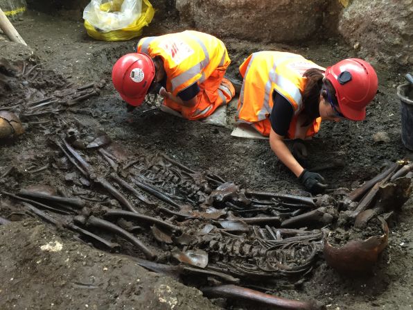 Archeologists work at a mass burial site suspected of containing 30 victims of the Great Plague of 1665, unearthed at Crossrail's Liverpool Street site in London. 