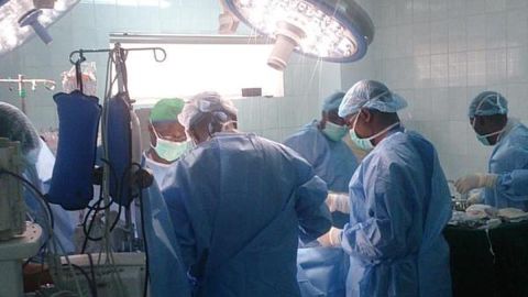 Surgeons at Abuja National Hospital in Nigeria prepare the eight year-old patient for heart surgery. 