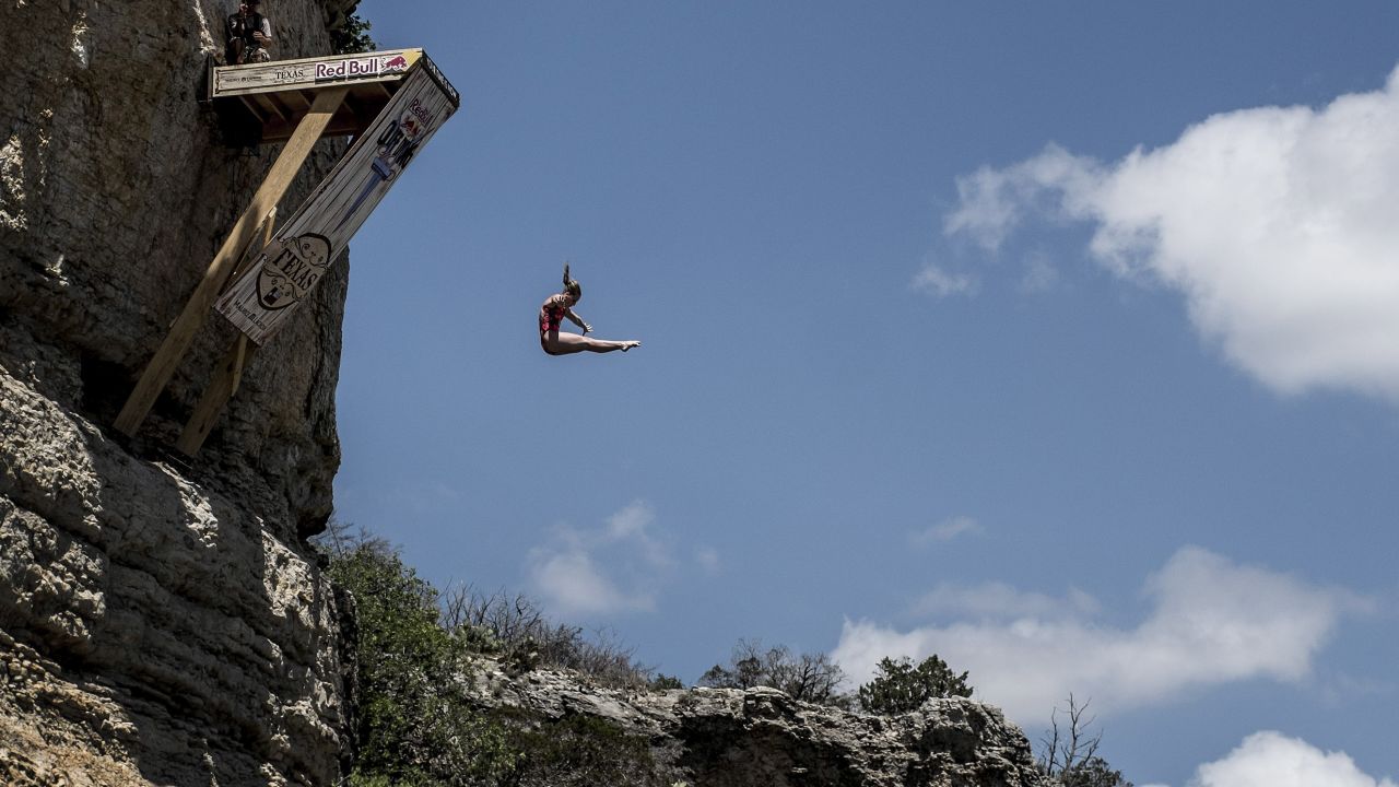 POSSUM KINGDOM LAKE, TEXAS - JUNE 6:  (EDITORIAL USE ONLY) In this handout image provided by Red Bull, Rachelle Simpson of the USA dives from the 20 metre platform at Hells Gate during the first round of the second stop of the Red Bull Cliff Diving World Series on June 6, 2014 in Possum Kingdom Lake, Texas. (Photo by Dean Treml/Red Bull via Getty Images)