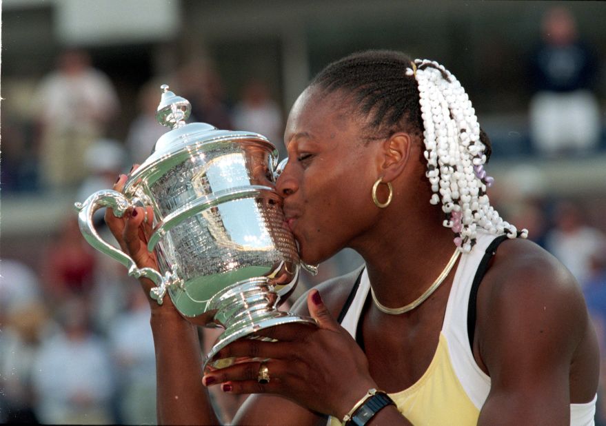 Serena sports a beaded hairstyle as she celebrates her first U.S. Open title -- and her first major -- back in 1999.