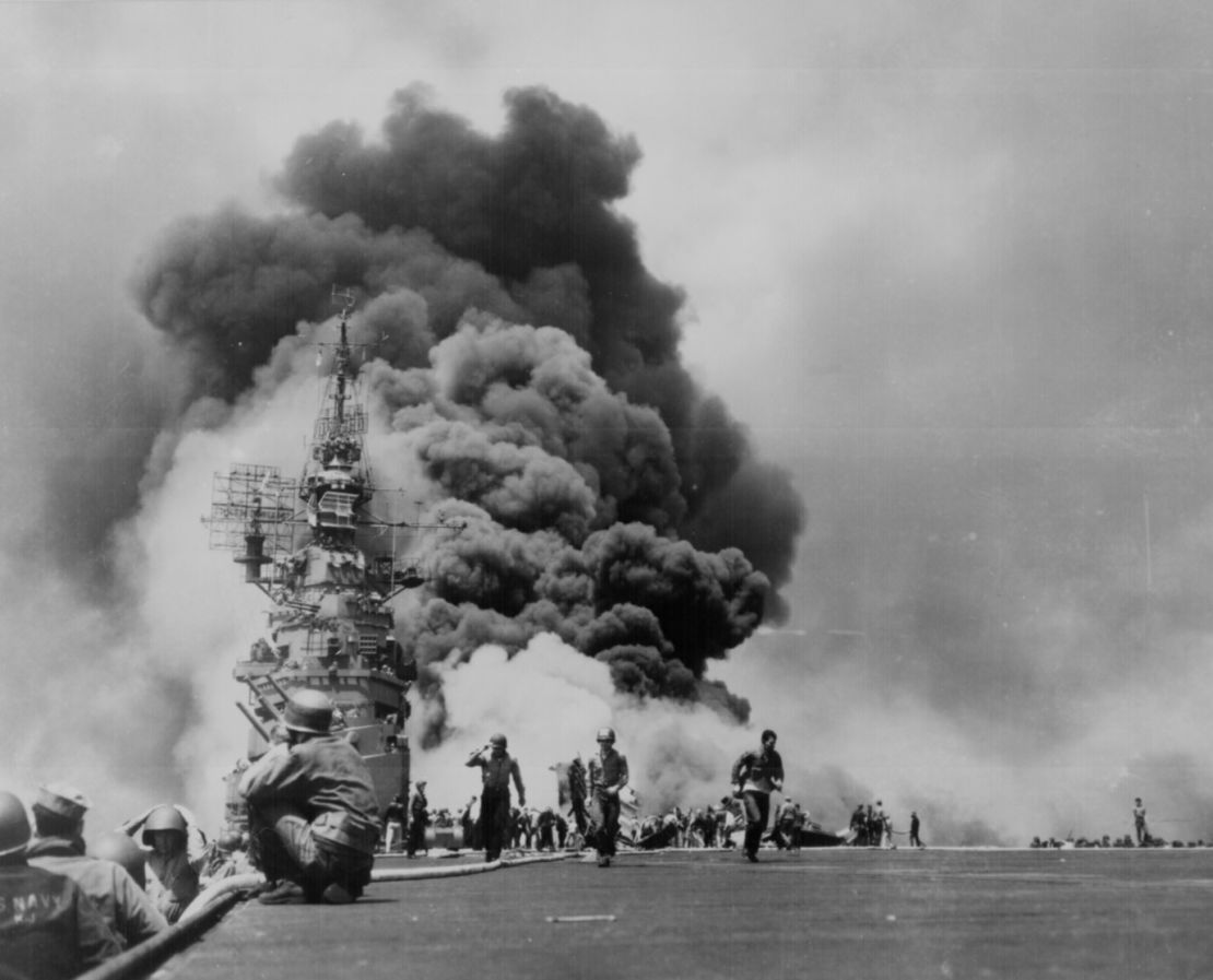 Smoke billows above the stricken USS Bunker Hill which was hit by two Kamikazes in 30 seconds on 11 May 1945 off Kyushu. General Photographic File of the Department of Navy.