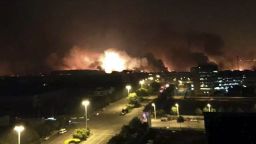In this photo released by Xinhua News Agency smoke and fire erupt into the night sky after an explosion in the Binhai New Area in north China's Tianjin Municipality on Thursday Aug. 13, 2015. Chinese state media reported huge explosions at the Tianjin port late Wednesday with large numbers of people reported injured. (Yue Yuewei/Xinhua via AP) CHINA OUT - NO SALES