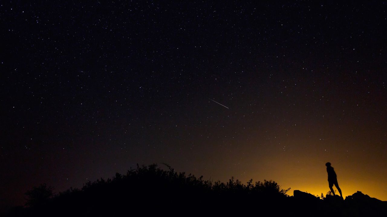 A Perseid meteor along the Milky Way illuminates the dark sky near Villadiego in the province of Burgos, northern Spain on August 12. 