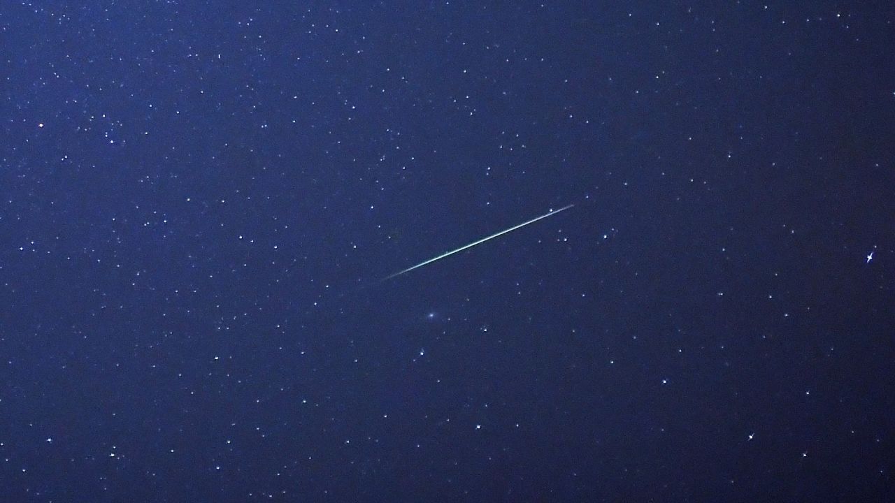 A meteor streaks across the sky above Halle, Germany, early Thursday, August 13. The Perseid meteor shower occurs every August when the Earth passes through the debris and dust of the Comet Swift-Tuttle. 