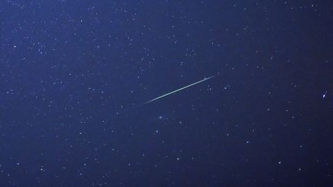 A meteor streaks across the sky above Halle, Germany, early Thursday, August 13. The Perseid meteor shower occurs every August when the Earth passes through the debris and dust of the Comet Swift-Tuttle.