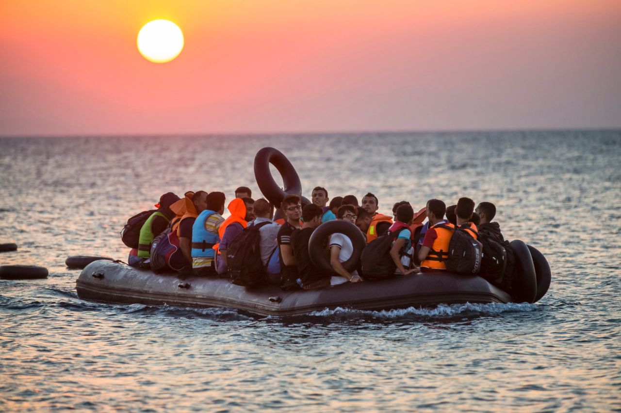 Migrants on a dinghy arrive at the island of Kos, Greece, after crossing from Turkey, on Thursday, August 13. Greece has become the main gateway to Europe for tens of thousands of refugees and economic migrants, mainly Syrians fleeing war, as fighting in Libya has made the alternative route from North Africa to Italy increasingly dangerous.