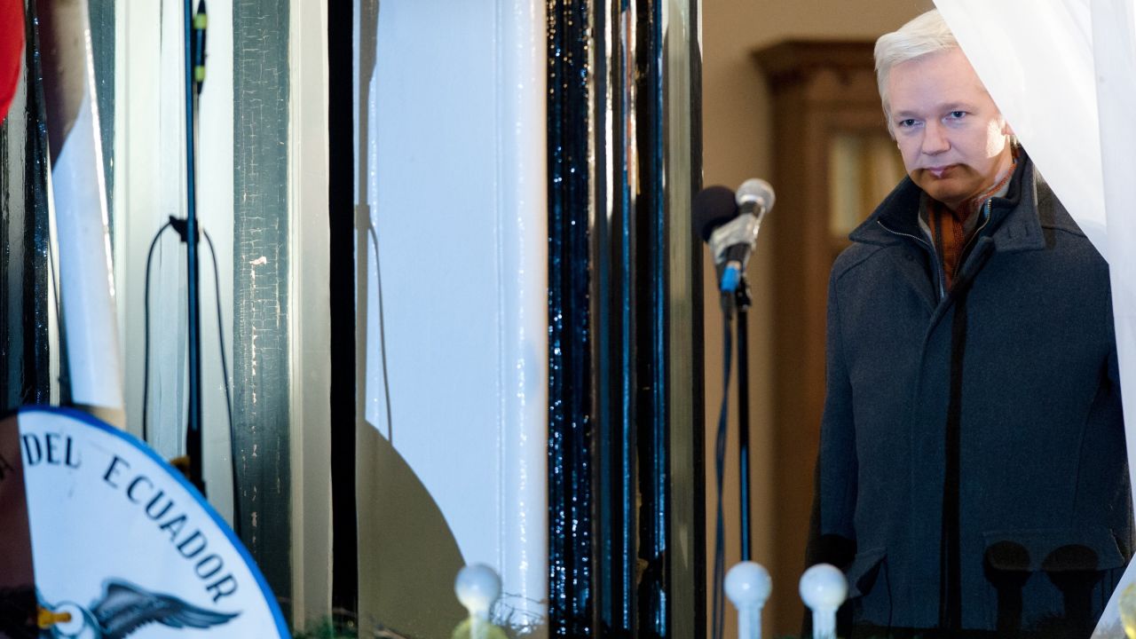WikiLeaks founder Julian Assange prepares to address the media and supporters from the window of the Ecuadorian Embassy in London in 2012.