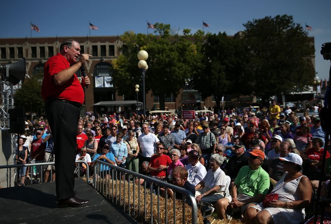 When they're not addressing the masses, as Huckabee does here on August 13, candidates will be found across the fairgrounds sampling the many specialty snacks.