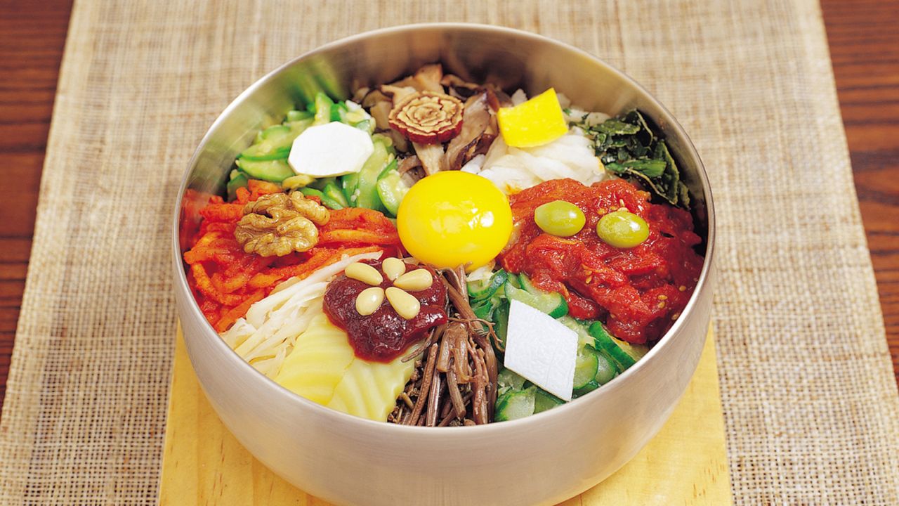 Bibimbap combines rice, vegetables and eggs with a spicy sauce.