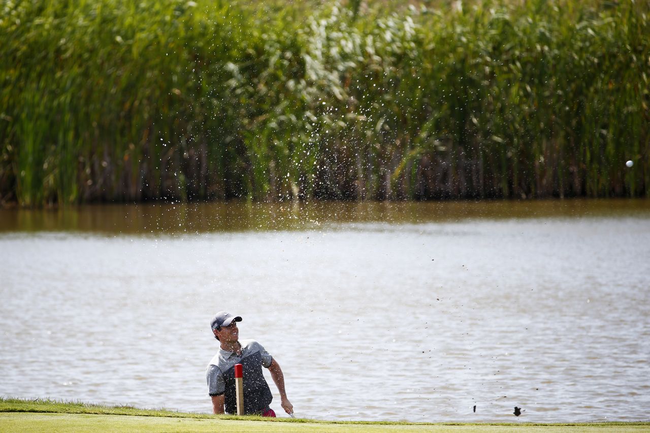 There were concerns over world No. 1 Rory McIlroy's fitness before the tournament but the Northern Irishman was nimble enough to play out of the water on the fifth hole. He finished on one-under 71.