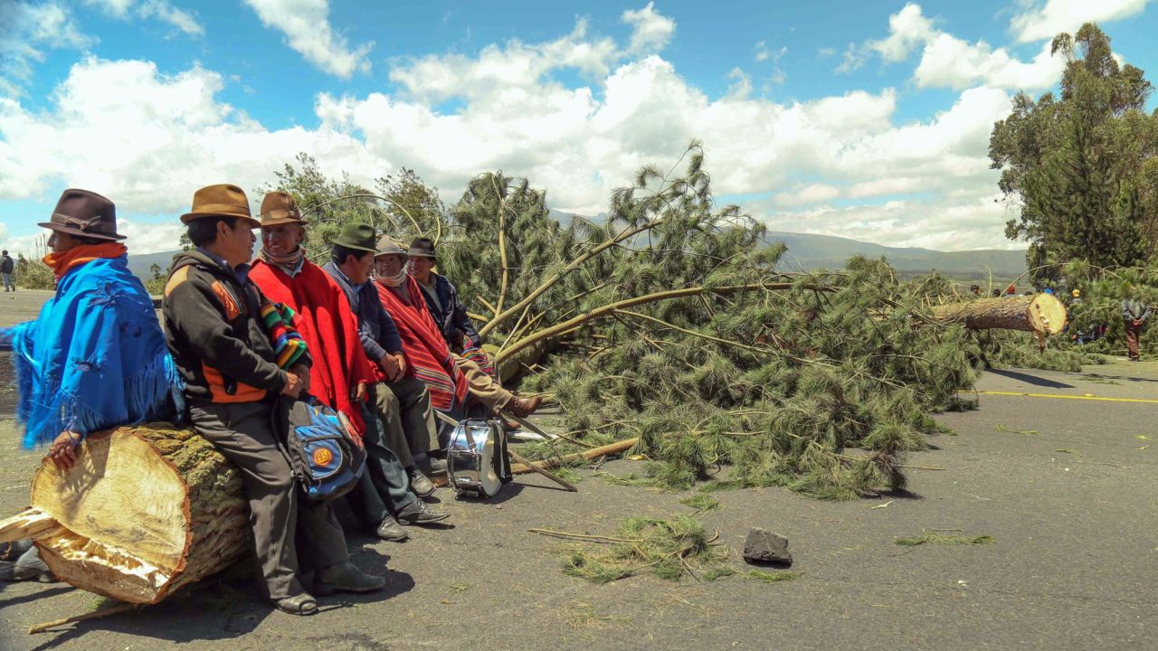 Indigenous people  block a road in El Chasqui, Cotopaxi province, Ecuador on August 13, 2015, during a strike organized by opposition indigenous groups and unions. Several roads leading to the capital were blocked Thursday in rejection to the government of Ecuadorean President Rafael Correa.  AFP PHOTO / PABLO COZZAGLIO        (Photo credit should read PABLO COZZAGLIO/AFP/Getty Images)