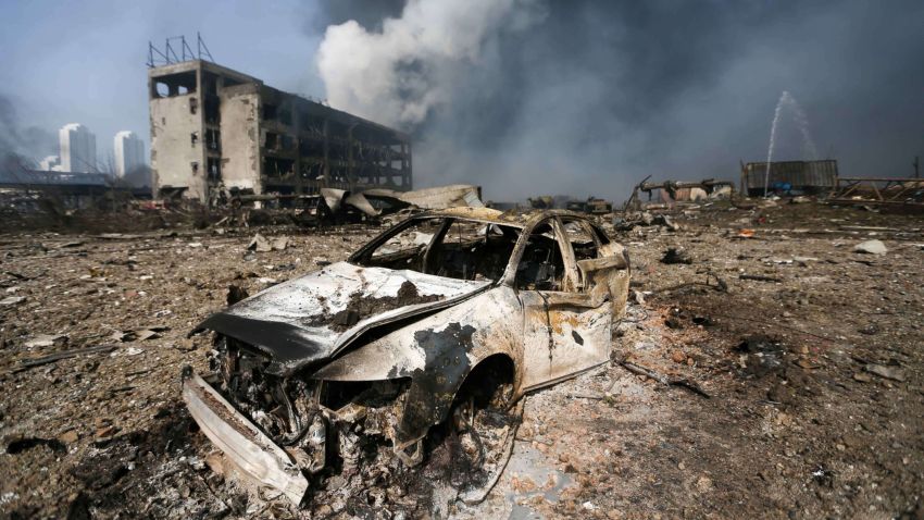 A damaged car is seen at the site of the massive explosions in Tianjin on August 13, 2015. Enormous explosions in a major Chinese port city killed at least 44 people and injured more than 500, state media reported on August 13, leaving a devastated industrial landscape of incinerated cars, toppled shipping containers and burnt-out buildings. CHINA OUT AFP PHOTOSTR/AFP/Getty Images