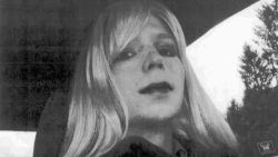 FILE - In this undated file photo provided by the U.S. Army, Pfc. Chelsea Manning poses for a photo wearing a wig and lipstick. A military prison psychologist is refusing to recommend that Manning's gender be officially changed to female on her Army employee-benefits file. Lawyers for the transgender solider imprisoned for leaking classified information made the assertion in a federal court filing Monday, Dec. 5, 2016, in Washington. (U.S. Army via AP, File)