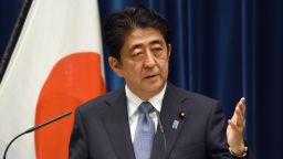 Japanese Prime Minister Shinzo Abe gestures as he answers questions following his war anniversary statement that neighboring nations will scrutinize for signs of sufficient remorse over Tokyo's past militarism at his official residence in Tokyo on August 14, 2015. Abe expressed deep remorse over World War II and said previous national apologies were unshakeable, but emphasized future generations should not have to keep saying sorry.