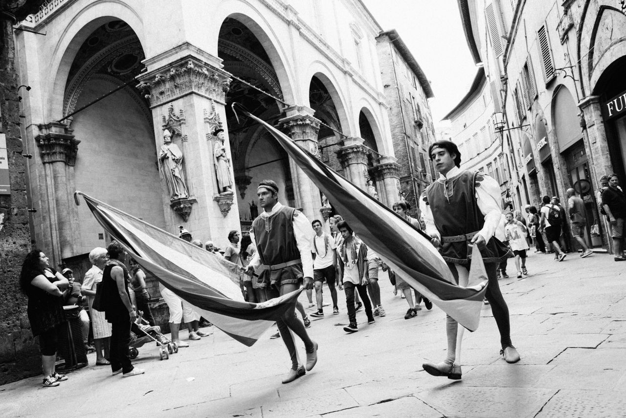 "The Palio is a hugely colorful event but I've always enjoyed shooting in black and white -- for me the Palio feels quite timeless, and the absence of color helped maintain that feeling," says Funnell, who attended the event in 2014.<br /><br />"The race itself takes places after hours of parades and build up ... the importance of the race to the cultural identity of the Sienese cannot be taken lightly and is something very difficult for an outsider to fully grasp."