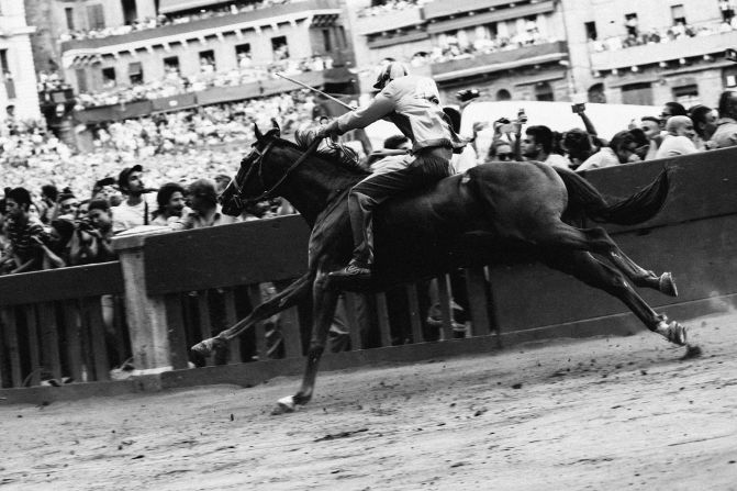 The Palio di Siena is a horse race like no other on earth. The mad, sometimes brutal dash around the Tuscan city's Piazza del Campo has been contested since medieval times. <br /><br />The biannual event, which takes place on July 2 and August 16, sees Siena's neighboring districts battle it out for supremacy and bragging rights. The race lasts barely 90 seconds with 10 jockeys riding bareback three times around the piazza in front of a baying crowd. Unlike traditional racing, horses that unseat their riders can still win.<br /><br />As Siena gears up for this year's second race on Sunday, British photographer <a href="index.php?page=&url=http%3A%2F%2Fwww.gregfunnell.com%2F%23%21%2Findex" target="_blank" target="_blank">Greg Funnell</a> explains what it's like to be in the thick of the action at this extraordinary spectacle.