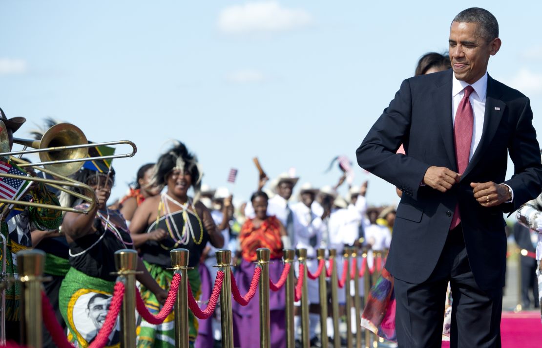 President Obama dances upon arrival in Dar Es Salaam, Tanzania, in 2013. 