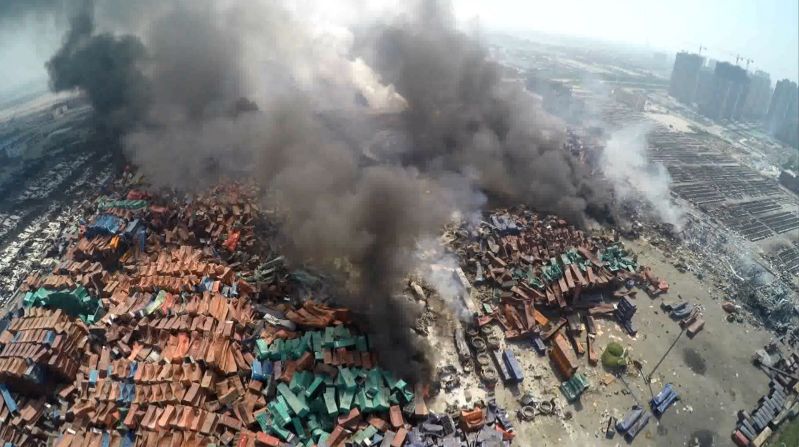 An aerial image taken shows toxic smoke rising from debris in Tianjin, a sprawling port city of more than 13 million people about 70 miles from Beijing.