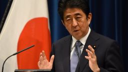 Japanese Prime Minister Shinzo Abe gestures as he answers questions following his war anniversary statement that neighbouring nations will scrutinise for signs of sufficient remorse over Tokyo's past militarism at his official residence in Tokyo on August 14, 2015.