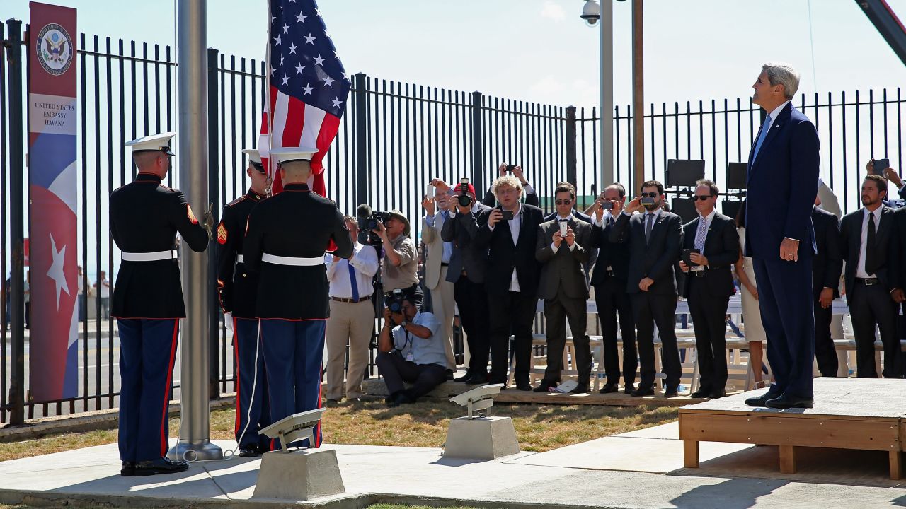 HAVANA, CUBA - AUGUST 14:  Secretary of State John Kerry (R) watches as Marines raise the American flag at the U.S. Embassy August 14, 2015 in Havana, Cuba. Kerry will visited the reopened embassy, the first time an American secretary of state has visited Cuba since 1945, a symbolic act after the the two former Cold War enemies reestablished diplomatic relations in July.  (Photo by Chip Somodevilla/Getty Images)