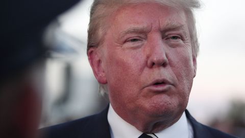 Republican presidential candidate Donald Trump speaks with the media on his way to his car after delivering the keynote address at the Genesee and Saginaw Republican Party Lincoln Day Event August 11, 2015 in Birch Run, Michigan.