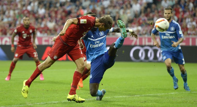 Bayern Munich demolished Hamburg 5-0 in the first game of its Bundesliga title defense. Here Thomas Muller heads the first of his two second-half goals, which came in the space of four minutes at the Allianz Arena. 