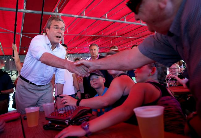 Bush greets fairgoers on August 14.