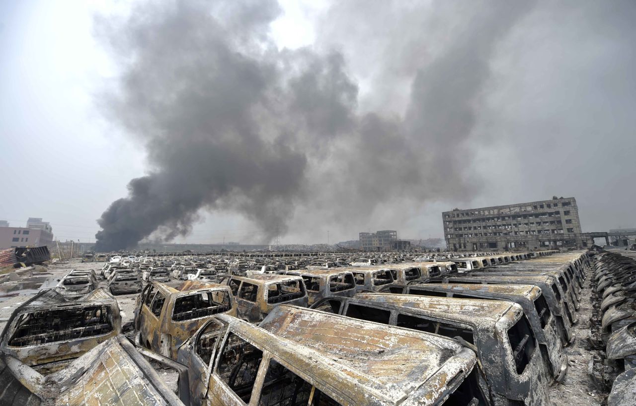 Smoke rises as damaged cars explode on Saturday, August 15.