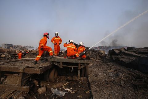 Firefighters work August 15 at the site of the explosions. 