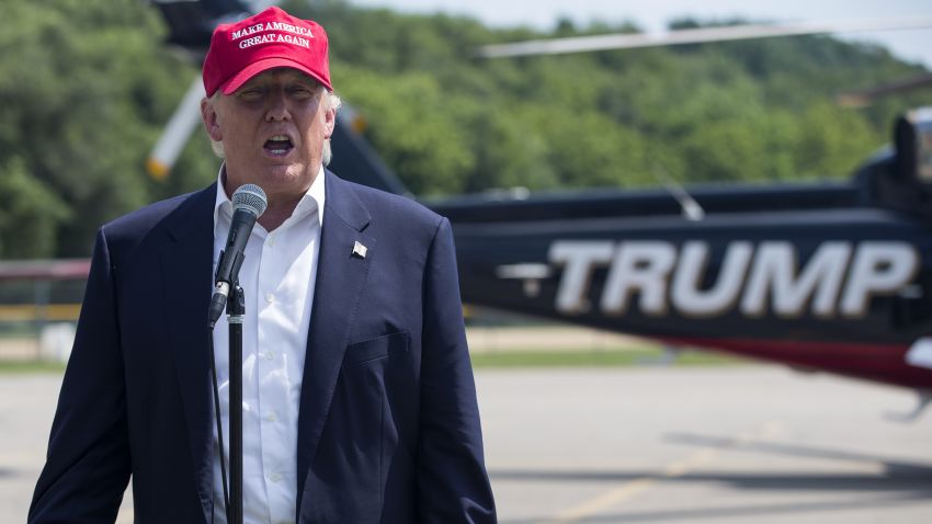 DES MOINES, IA - AUGUST 15: Republican presidential candidate businessman Donald Trump speaks with reporters after arriving at the Iowa State Fair on August 15, 2015 in Des Moines, Iowa. The Iowa State Fair is one of the oldest and largest agricultural and industrial expositions in the United States. The fair runs through August 23. (Photo by Aaron P. Bernstein/Getty Images)