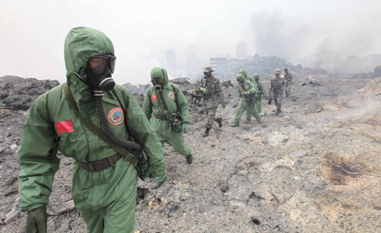 Soldiers from the National Nuclear Biochemical Emergency Rescue Team launch a rescue mission August 15 at the core area of the explosion site.