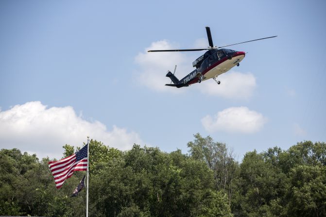 Republican presidential candidate Donald Trump arrives in his helicopter on August 15.