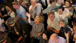 Democratic presidential candidate Hillary Clinton waves to fairgoers while campaigning at the Iowa State Fair on August 15, 2015 in Des Moines, Iowa.