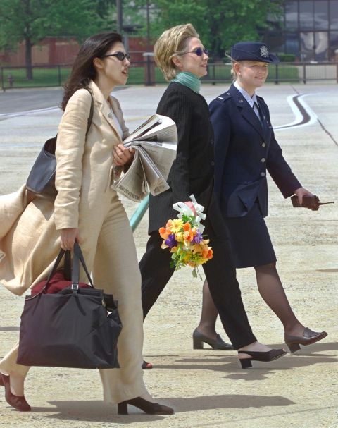 Abedin walks with Clinton at Andrews Air Force Base in 2000 as the Clintons prepared to leave for a wedding in Arkansas.