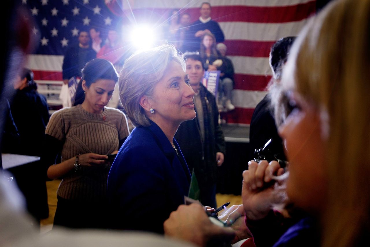 Clinton greets people during a campaign stop at The McConnell Center January 7, 2008 in Dover, New Hampshire, as Abedin stands behind her.