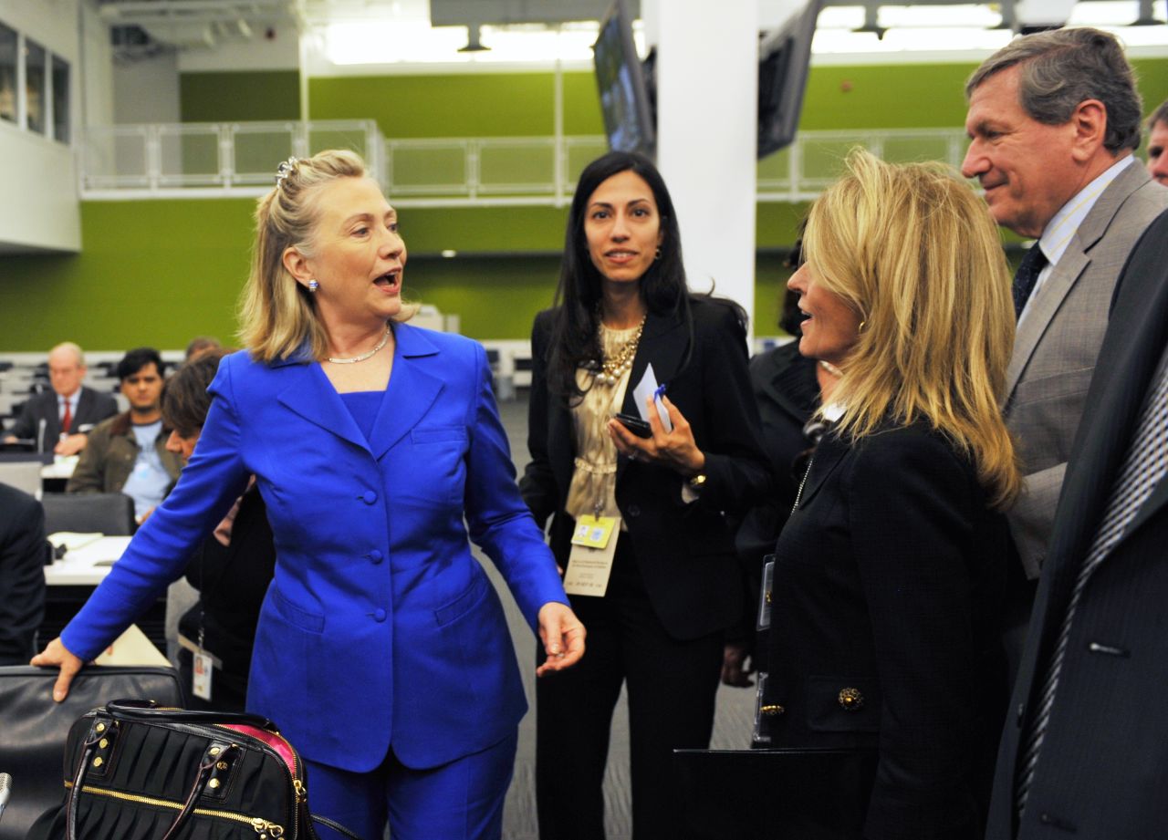 Clinton (left), accompanied by Abedin (center), greets people before a meeting on the Flood Emergency in Pakistan September 19, 2010 at United Nations headquarters in New York.