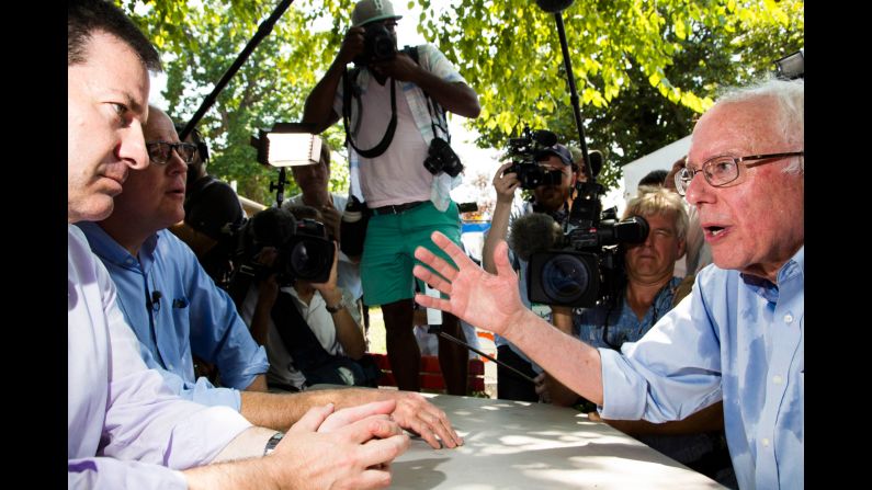 Democatic hopeful Sen. Bernie Sanders, right, speaks to journalists Mark Halperin and John Heilemann. Trump and Clinton may have drawn large crowds, but according to CNN's Eric Bradner, Sanders drew the largest crowds of the afternoon.