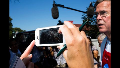 A reporter uses a cracked smart phone to record Bush. The Republican presidential candidate has become widely known for his <a href="http://www.cnn.com/2015/08/14/politics/jeb-bush-paleo-diet-iowa/">weight loss on the "Paleo" diet. </a>