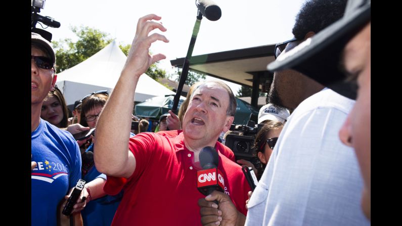 Former Arkansas governor and GOP presidential candidate Mike Huckabee speaks to the crowd. He offered a counter to Jeb Bush's promise to bring the economy back to 4% growth: 6%. "I believe we can get it to 6 or higher with a fair tax. I'm convinced," Huckabee told a crowd of potential caucus-goers at the Iowa State Fair on Thursday. "I guarantee you we will goose the economy if you bring $11 trillion of working capital back to this country."