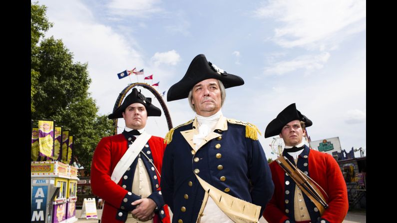Ron Carnegie attends the state fair as George Washington before heading to an Iowa Cubs minor league baseball game. Photographing him there was photographer Landon Nordeman's favorite moment: "I mean, really, how American can you get?" As for his second favorite moment, Nordeman says: "I got to milk a cow."