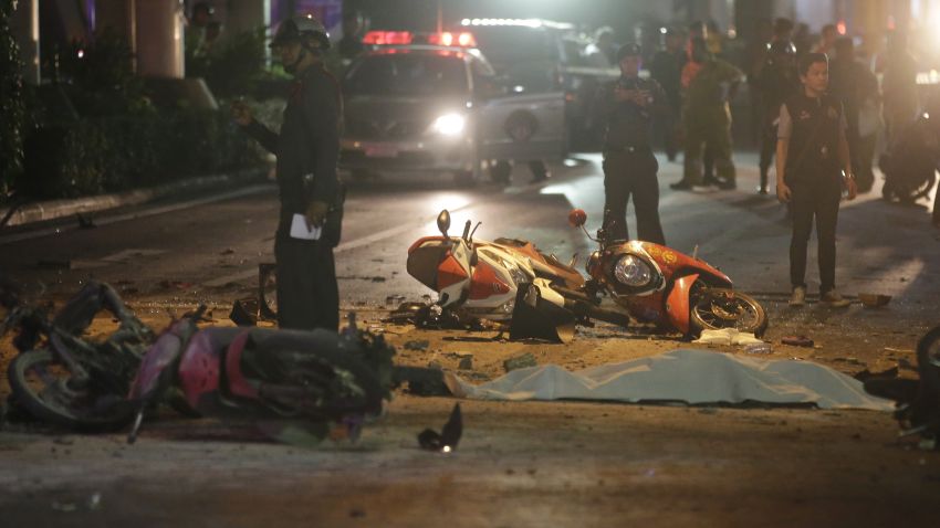 Motorcycles and debris lies on the pavement after an explosion in Bangkok, Monday, Aug. 17, 2015. A large explosion rocked a central Bangkok intersection during the evening rush hour, killing a number of people and injuring others, police said. (AP Photo/Sackchai Lalit)